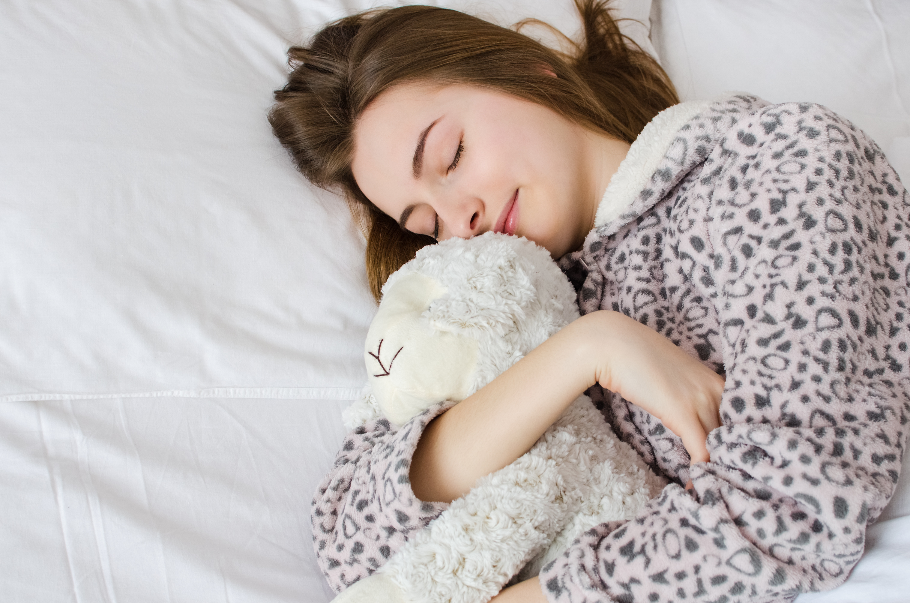 Happy young woman with blonde hair sleeping Happy young woman with blonde hair sleeping